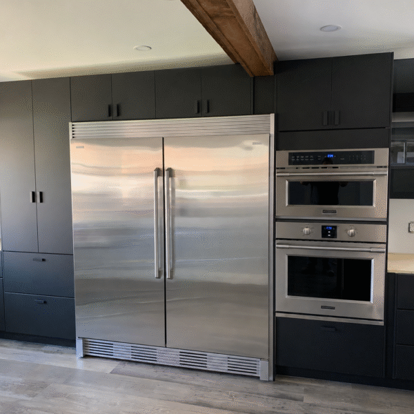 Bold Matte Black Kitchen with Warm Wood Beams